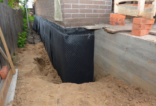Happy homeowners after waterproofing job in Hughesville